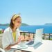 Two in five UK workers continue checking emails on holiday, with top earners working up to three days